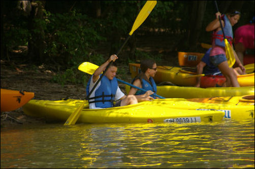 Alex and Garrett launching their kayaks. Alex and Garrett launching their kayaks.