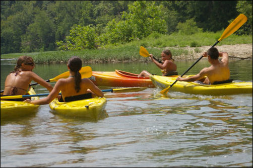 Kayaks Everybody jocking for position to tip over somebody.