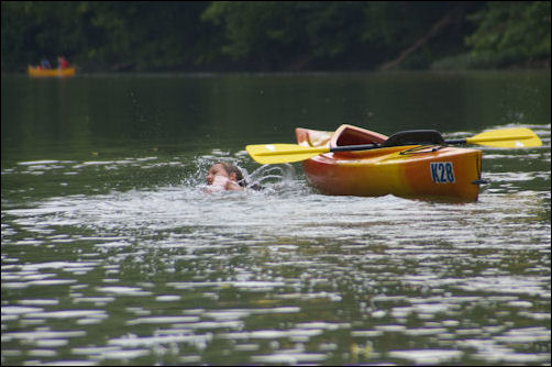 Taylor swimming. Taylor swimming along side her kayak.